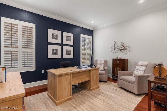 office area featuring crown molding and light hardwood / wood-style flooring