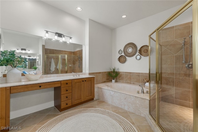 bathroom featuring plus walk in shower, tile patterned floors, and vanity