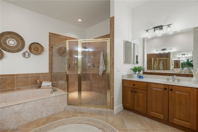 bathroom with independent shower and bath, vanity, and tile patterned floors