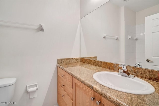 bathroom with vanity and toilet