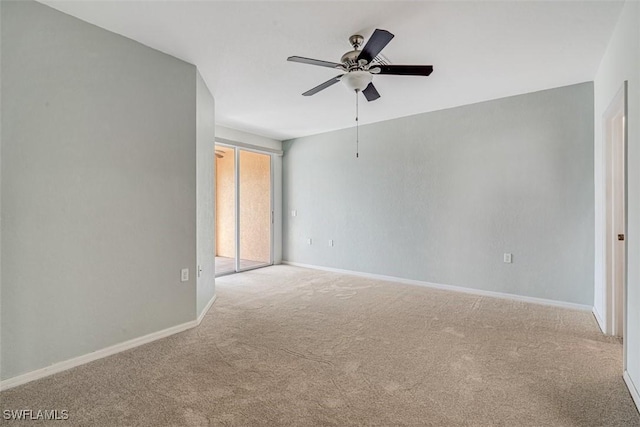 unfurnished room with light colored carpet and ceiling fan