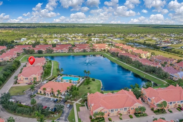 birds eye view of property featuring a water view