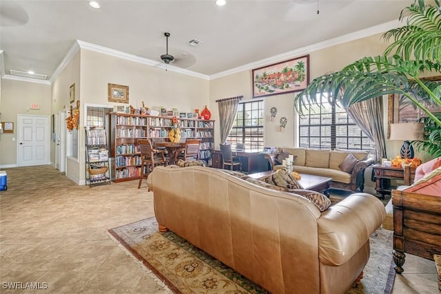 living room with ornamental molding and ceiling fan