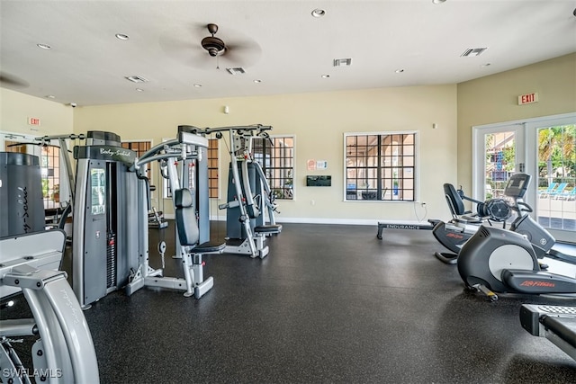 exercise room featuring french doors and ceiling fan