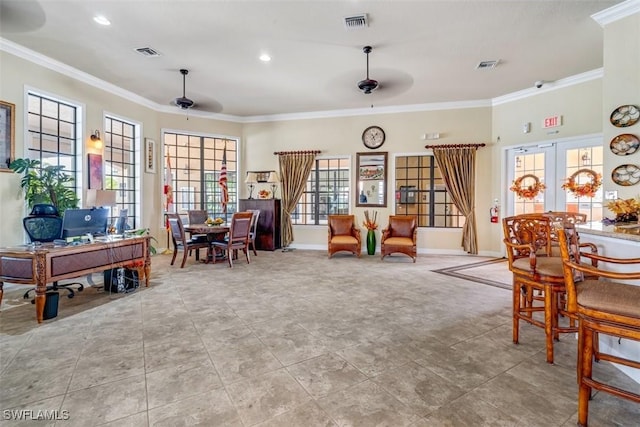 interior space with ceiling fan, crown molding, and french doors