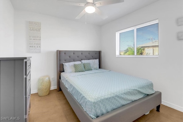 tiled bedroom with ceiling fan