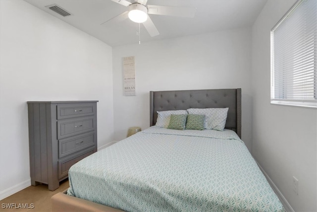 bedroom featuring ceiling fan and light carpet