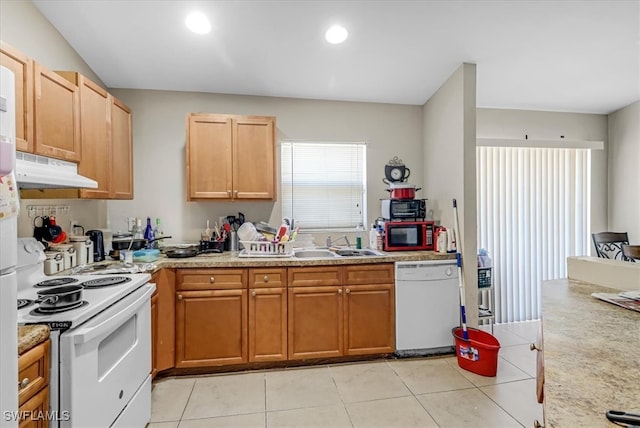 kitchen with white appliances, sink, and light tile patterned flooring