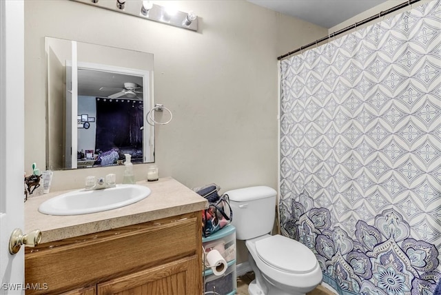 bathroom featuring ceiling fan, vanity, and toilet