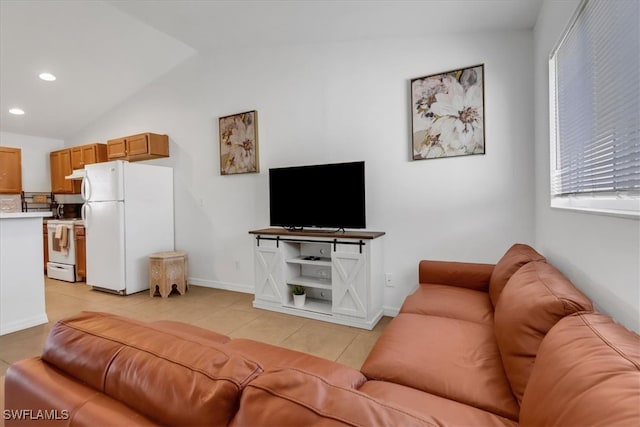 tiled living room featuring vaulted ceiling