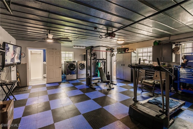 gym featuring washing machine and clothes dryer