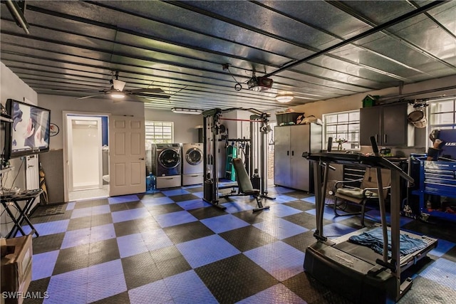 interior space featuring ceiling fan, a garage door opener, and washer and dryer