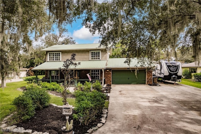 view of front of property featuring brick siding, a porch, concrete driveway, a garage, and a front lawn