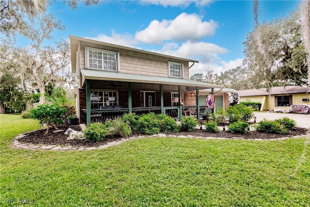 view of front facade with covered porch and a front yard