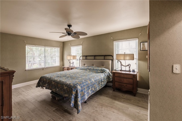 bedroom featuring light wood-type flooring and ceiling fan