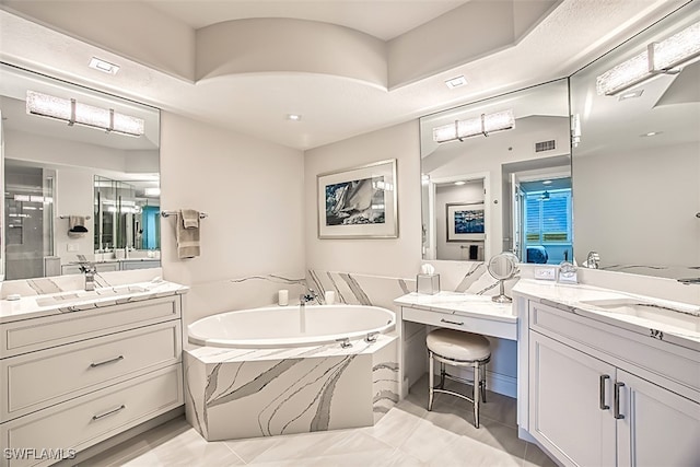 bathroom with shower with separate bathtub, vanity, and tile patterned floors