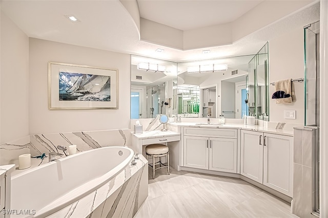 bathroom featuring tile patterned flooring, shower with separate bathtub, and vanity