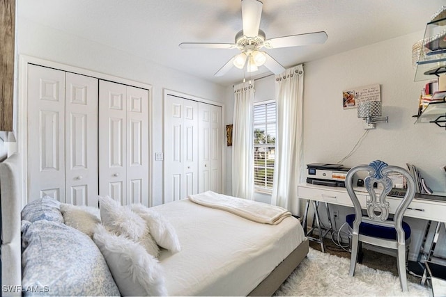 19914 Lake Vista Cir N Unit 2, Lehigh Acres, FL 33936 - bedroom with multiple closets and a ceiling fan
