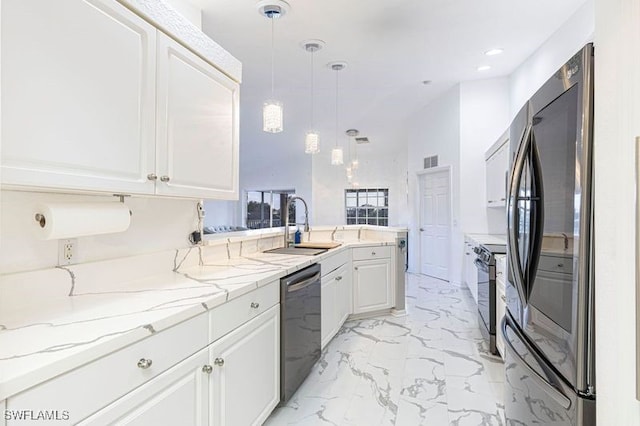 kitchen with stainless steel appliances, white cabinetry, light stone countertops, hanging light fixtures, and kitchen peninsula