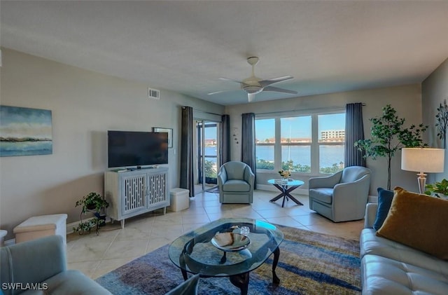 5103 Sunnybrook Ct Unit 3, Cape Coral, FL 33904 - living room with tile patterned flooring, ceiling fan, and baseboards