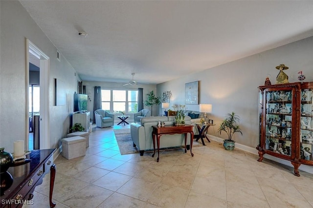 5103 Sunnybrook Ct Unit 3, Cape Coral, FL 33904 - living area with ceiling fan, light tile patterned flooring, and baseboards