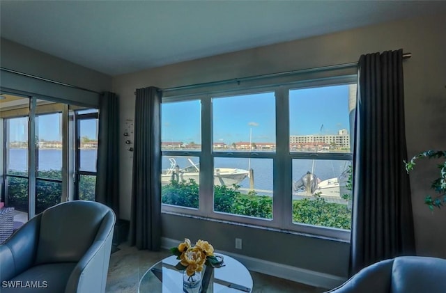 5103 Sunnybrook Ct Unit 3, Cape Coral, FL 33904 - living area with a water view, plenty of natural light, and baseboards