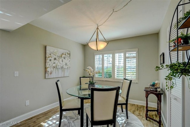 5103 Sunnybrook Ct Unit 3, Cape Coral, FL 33904 - dining space featuring light wood-style flooring and baseboards