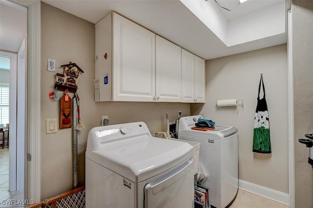 5103 Sunnybrook Ct Unit 3, Cape Coral, FL 33904 - washroom featuring cabinet space, washing machine and clothes dryer, baseboards, and light tile patterned floors