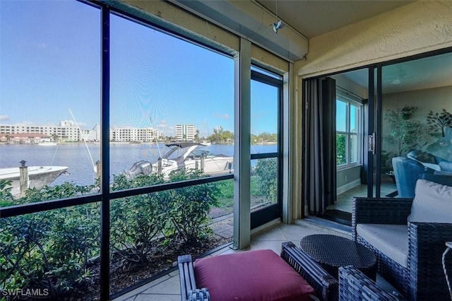 5103 Sunnybrook Ct Unit 3, Cape Coral, FL 33904 - sunroom featuring a water view and tile patterned floors