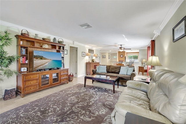 living room featuring ornamental molding, light tile patterned flooring, and ceiling fan