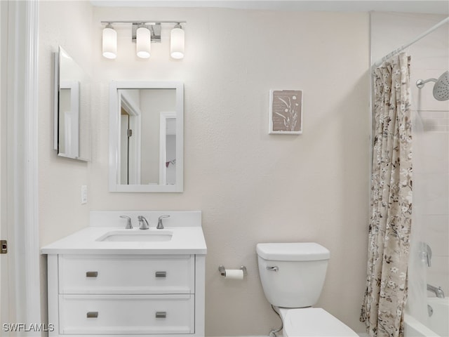 full bathroom featuring vanity, shower / bath combination with curtain, and toilet