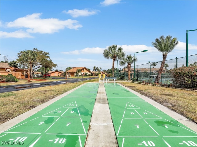 view of property's community featuring a yard