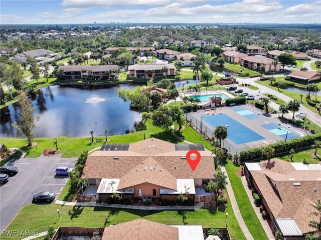 drone / aerial view with a water view