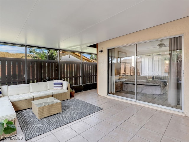 unfurnished sunroom featuring ceiling fan