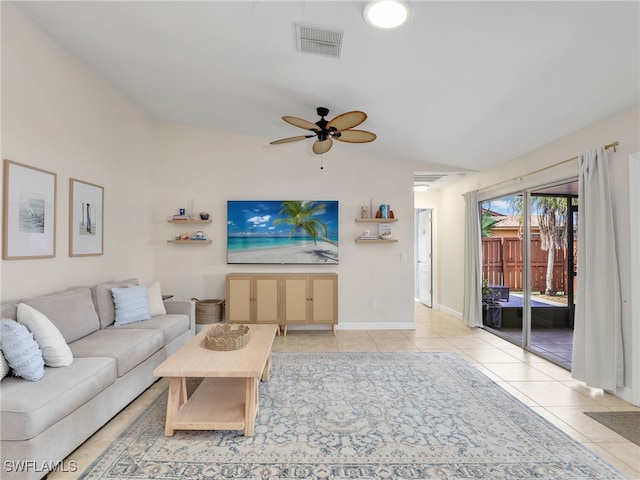 tiled living room featuring ceiling fan and lofted ceiling