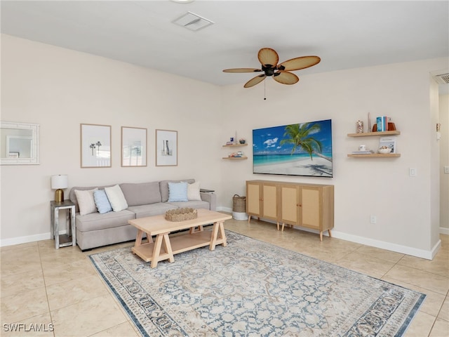 tiled living room featuring ceiling fan