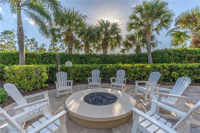 patio terrace at dusk with an outdoor fire pit