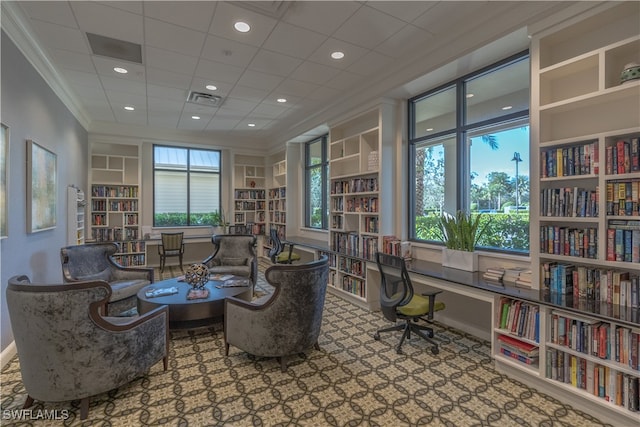 office space with built in features and ornamental molding