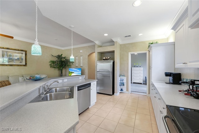 kitchen with sink, stainless steel appliances, crown molding, decorative light fixtures, and white cabinets