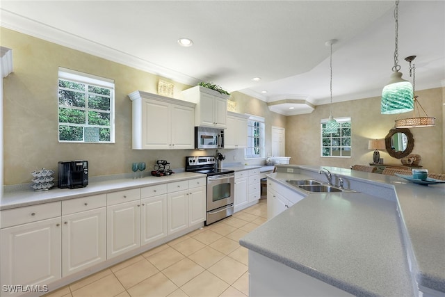 kitchen with white cabinets, a healthy amount of sunlight, sink, and appliances with stainless steel finishes