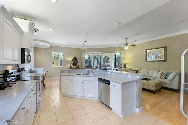 kitchen featuring white cabinetry, ornamental molding, stainless steel appliances, and light wood-type flooring