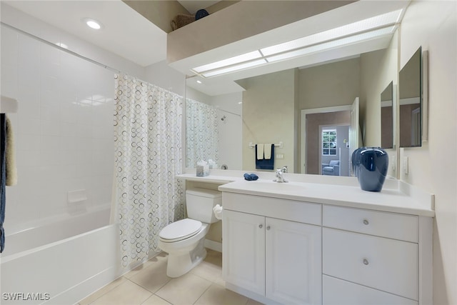 full bathroom featuring tile patterned floors, shower / bath combo with shower curtain, vanity, and toilet