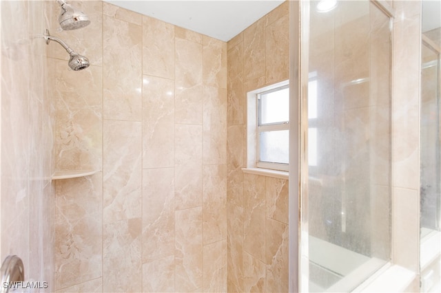 bathroom with tiled shower