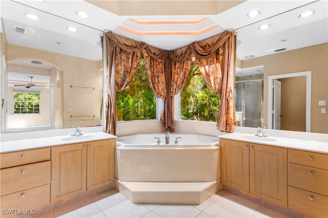 bathroom featuring tile patterned flooring, vanity, and separate shower and tub