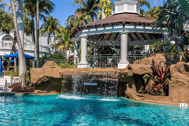 view of swimming pool featuring a gazebo and pool water feature