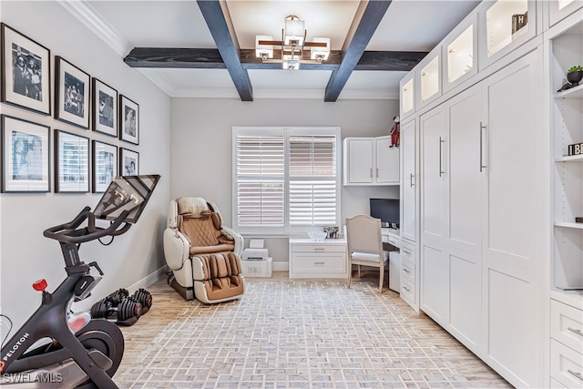 home office with a wealth of natural light, beamed ceiling, built in desk, and coffered ceiling