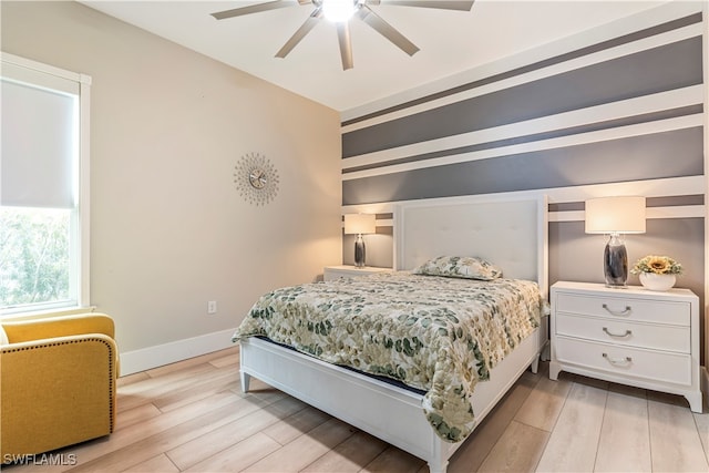 bedroom with light wood-type flooring and ceiling fan