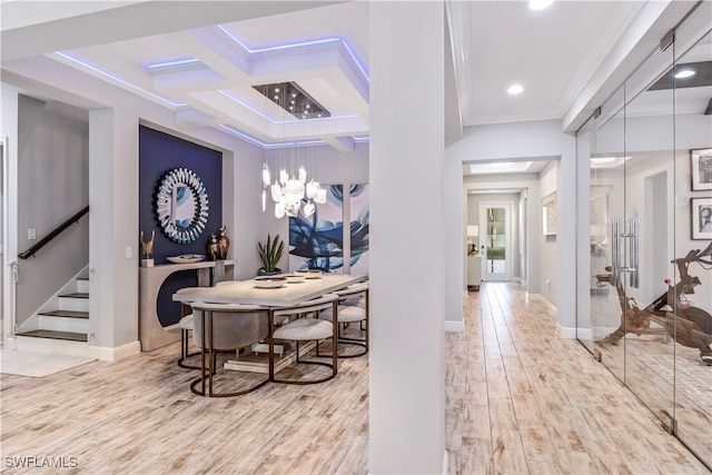 dining area with beamed ceiling, light hardwood / wood-style floors, crown molding, and coffered ceiling