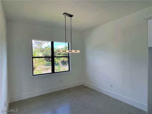 unfurnished dining area with concrete flooring