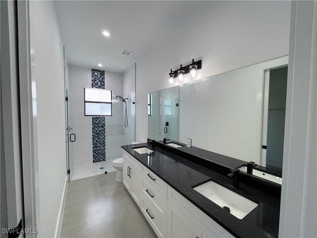 442 4th St SE, Naples, FL 34117 - full bath featuring a shower stall, double vanity, toilet, and recessed lighting